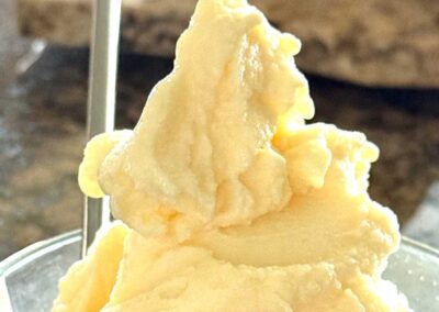 Image of pineapple ice cream, featuring Healthy Ninja Creami Recipes and highlighting a copycat Ninja Creami Dole Whip pineapple ice cream recipe.